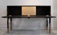 A cabinet in sanded oak veneer stained with black china ink