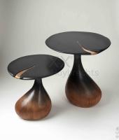 Two side tables with organic shapes in solid oak partially stained with ink